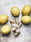 Lemons with ginger roots — Stock Photo