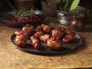 Christmas, celebration food, garnish selection, pigs in blankets, cranberries, rosemary — Stock Photo