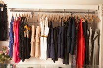 Rack of dresses and skirts — Stock Photo