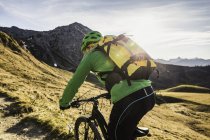 Cyclist on mountain biking area, Kleinwalsertal, trails below Walser Hammerspitze, Austria — Stock Photo