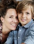 Close up of smiling mother and son — Stock Photo