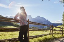 Female hiker looking out at Dolomites, Sexten, South Tyrol, Italy — Stock Photo