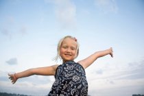 Little girl with out stretched arms — Stock Photo