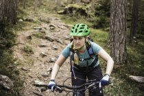 Woman mountain biking, Bozen, South Tyrol, Italy — Stock Photo