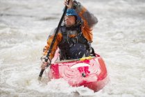 Male kayaker paddling River Dee rapids — Stock Photo