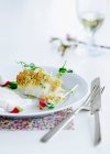 Plate of crusted fish — Stock Photo