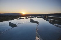 Hot spring terraces at sunset, Pamukkale, Anatolia, Turkey — Stock Photo