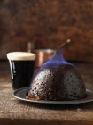 Flaming Christmas pudding — Stock Photo