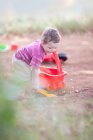 Toddler boy playing on dirt road — Stock Photo