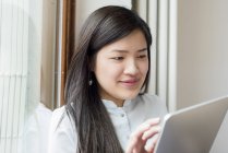 Close up of woman using digital tablet — Stock Photo
