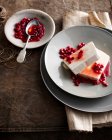 Plate of ice cream with pomegranate — Stock Photo
