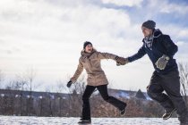 Two beautiful friends playing in the snow, Montreal, Quebec, Canada — Stock Photo
