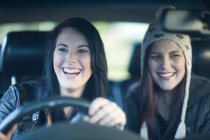 Two young women driving — Stock Photo