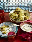 Onion bhajis and mint chutney served on table — Stock Photo
