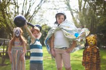 Portrait of young children wearing fancy dress, outdoors — Stock Photo