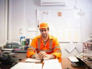Apprentice engineer in office — Stock Photo