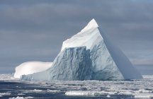 Iceberg in ice floe in southern ocean — Stock Photo
