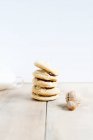 Stacked of hazelnut cookies and hazelnuts — Stock Photo