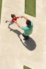 Father swinging son around — Stock Photo