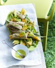Kingfish skewers with zucchini served on table — Stock Photo