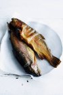 Plate of baked whole fish — Stock Photo