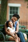 Mother and daughter relaxing in park — Stock Photo