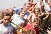 People riding a rollercoaster — Stock Photo