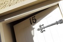 Front door with number fifteen, tilt — Stock Photo