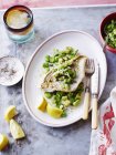 Steamed snapper fish with beans in plate — Stock Photo