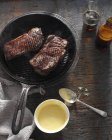 Sirloin steak in frying pan with bearnaise sauce — Stock Photo
