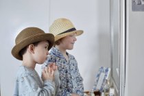 Boys playing dress-up in bedroom — Stock Photo