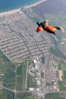 Man wingsuit flying over Empuriabrava, Spain — Stock Photo