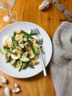 Plate of salad with eggs, cucumber and fish — Stock Photo