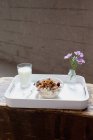 Breakfast tray with bowl of muesli — Stock Photo