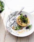 Plate of crab tartlet with salad — Stock Photo