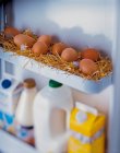 Freshly laid eggs in straw — Stock Photo