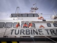 Offshore windfarm engineers in port on ship — Stock Photo