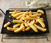 Chunky chips on baking sheet — Stock Photo