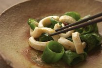 Asian dish and chopsticks — Stock Photo