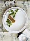 Top view of nouvelle cuisine fish dish — Stock Photo