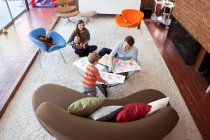 Family playing in living room — Stock Photo