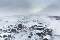 Frozen glacial landscape covered in mist — Stock Photo