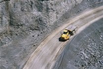 Aerial view of yellow truck in quarry — Stock Photo