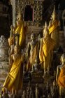 Golden statues in a buddhist temple, Luang Prabang, Laos, Southeast Asia — Stock Photo