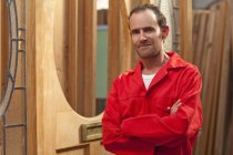 Carpenter with arms folded, portrait — Stock Photo