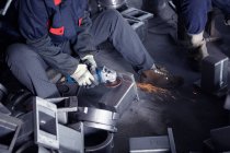 Grinding in cast iron foundry — Stock Photo