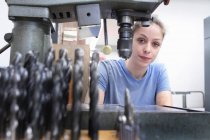 Portrait of female engineer in workshop — Stock Photo