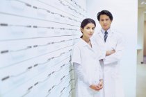 Portrait of male and female pharmacists in pharmacy — Stock Photo