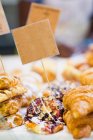 Stacks of fresh pastries for sale — Stock Photo