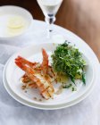 Plate of prawn salad with potatoes and micro herbs — Stock Photo